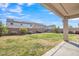 Large backyard with covered patio, ideal for outdoor entertaining and relaxation at 9609 E Monte Ave, Mesa, AZ 85209
