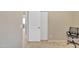 A bedroom featuring a closet, a chair, and carpet flooring at 9609 E Monte Ave, Mesa, AZ 85209