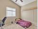 Bedroom with a full size bed, carpet, and large window at 9609 E Monte Ave, Mesa, AZ 85209