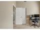 A bedroom featuring an office desk, a closet, and carpet flooring at 9609 E Monte Ave, Mesa, AZ 85209