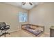 A bedroom featuring carpet floors, a built-in platform bed, and natural light at 9609 E Monte Ave, Mesa, AZ 85209