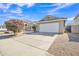 Charming single-story home featuring a two-car garage, landscaped front yard, and desert-friendly landscaping at 9609 E Monte Ave, Mesa, AZ 85209