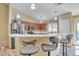 Well-equipped kitchen featuring stainless steel appliances, pendant lighting, and bar stool seating at 9609 E Monte Ave, Mesa, AZ 85209