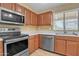 A kitchen featuring stainless steel appliances and ample cabinet space at 9609 E Monte Ave, Mesa, AZ 85209