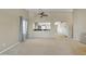 Bright living room with plush carpeting, a ceiling fan, and view of the dining area at 9609 E Monte Ave, Mesa, AZ 85209