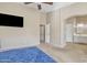 Open carpeted bedroom layout showcasing access to closet, hallway and bathroom at 9609 E Monte Ave, Mesa, AZ 85209