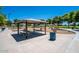Shaded picnic area with tables and benches, perfect for enjoying the outdoors at 9609 E Monte Ave, Mesa, AZ 85209