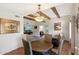 Spacious dining area with exposed wood beams and seamless flow to the living spaces at 9802 W Shasta Dr, Sun City, AZ 85351