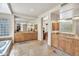 Elegant bathroom with double vanities, stone floors, glass block accents, and soaking tub at 10040 E Happy Valley Rd # 449, Scottsdale, AZ 85255