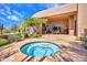 Outdoor hot tub with surrounding stone patio at 10040 E Happy Valley Rd # 449, Scottsdale, AZ 85255