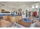 Open-concept kitchen featuring custom cabinetry, a center island, and an adjacent breakfast nook at 10040 E Happy Valley Rd # 449, Scottsdale, AZ 85255