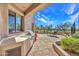 Covered patio with built-in outdoor grill and patio furniture at 10040 E Happy Valley Rd # 449, Scottsdale, AZ 85255