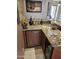 Granite countertop wet bar featuring built-in Marvel beverage fridge at 10236 W Westwind Dr, Peoria, AZ 85383