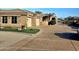 Expansive driveway leading to multiple garages, complemented by manicured landscaping and mature trees at 10236 W Westwind Dr, Peoria, AZ 85383