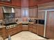 Modern kitchen with custom cabinets, stainless steel appliances, and granite countertops at 10236 W Westwind Dr, Peoria, AZ 85383