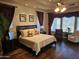 Stunning main bedroom featuring dark wood floors and bright natural light at 10236 W Westwind Dr, Peoria, AZ 85383