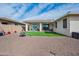 Spacious backyard with artificial turf, a built-in patio, and desert landscaping at 10545 E Texas Ave, Mesa, AZ 85212