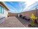 Desert backyard with low-maintenance landscaping and block wall surround at 10545 E Texas Ave, Mesa, AZ 85212