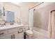 Well-lit bathroom with tile surround, framed mirror, and modern fixtures at 10545 E Texas Ave, Mesa, AZ 85212