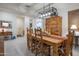 Elegant dining room with wooden furniture, Southwestern decor and views to other living spaces at 10545 E Texas Ave, Mesa, AZ 85212