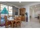 Cozy dining area with rustic wooden table and chairs, leading to the outdoor patio at 10545 E Texas Ave, Mesa, AZ 85212