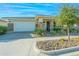 Charming home with a two-car garage and well-maintained landscaping, creating a welcoming curb appeal at 10545 E Texas Ave, Mesa, AZ 85212