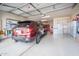 Spacious garage with epoxy flooring and built in white cabinets at 10545 E Texas Ave, Mesa, AZ 85212