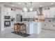 Bright kitchen with white cabinets, stainless appliances, and a central island with bar seating at 10545 E Texas Ave, Mesa, AZ 85212