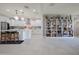 Spacious area connecting kitchen, library and living room with cohesive design elements at 10545 E Texas Ave, Mesa, AZ 85212