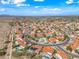 Expansive aerial view of a desert community, showcasing red-tiled roofs and beautiful blue sky at 10895 E Mission Ln, Scottsdale, AZ 85259