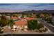 Stunning aerial view of a home with red tile roof in a lush, well-maintained community at 10895 E Mission Ln, Scottsdale, AZ 85259