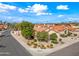 Aerial view of a home with lush landscaping and mature trees in a suburban neighborhood at 10895 E Mission Ln, Scottsdale, AZ 85259