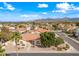 Inviting aerial view of a home with desert landscaping in a picturesque, Gathering-friendly community at 10895 E Mission Ln, Scottsdale, AZ 85259