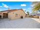 Paver patio in backyard featuring mature landscaping and architectural details for outdoor entertaining at 10895 E Mission Ln, Scottsdale, AZ 85259