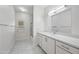 Elegant bathroom featuring a marble floor, walk-in shower, and a large mirror at 10895 E Mission Ln, Scottsdale, AZ 85259