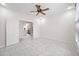 Bedroom with marble floors, double doors to another room, and neutral wall color at 10895 E Mission Ln, Scottsdale, AZ 85259