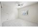 Bright bedroom with a ceiling fan, large window with shutters and marble floors creating a modern space at 10895 E Mission Ln, Scottsdale, AZ 85259