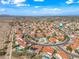 Scenic aerial shot of a community featuring single-Gathering homes with pools, mature trees, and desert landscaping at 10895 E Mission Ln, Scottsdale, AZ 85259