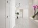 Bright hallway with white marble floors, neutral walls, and elegant decor creates a welcoming atmosphere at 10895 E Mission Ln, Scottsdale, AZ 85259