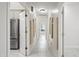 Hallway features marble floors, recessed lighting, and leads past the kitchen and into other rooms at 10895 E Mission Ln, Scottsdale, AZ 85259