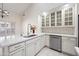 Bright kitchen features white cabinetry, stainless steel appliances, and quartz countertops at 10895 E Mission Ln, Scottsdale, AZ 85259