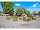 Corner lot features mature landscaping with trees, shrubs, and vibrant flowers at 10895 E Mission Ln, Scottsdale, AZ 85259