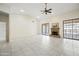 Spacious living room with marble floors, fireplace, large windows and high ceilings at 10895 E Mission Ln, Scottsdale, AZ 85259