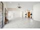 Bright living room with tile flooring, high ceilings, ceiling fan and a stone fireplace at 10895 E Mission Ln, Scottsdale, AZ 85259