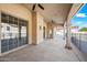 Enjoy this covered patio with large sliding glass doors and ceiling fans, perfect for outdoor living at 10895 E Mission Ln, Scottsdale, AZ 85259