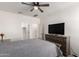 Well-lit bedroom with a large window and a ceiling fan at 11441 W La Reata Ave, Avondale, AZ 85392