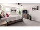 A peaceful bedroom with neutral tones, soft lighting, and a ceiling fan, creating a relaxing space at 11441 W La Reata Ave, Avondale, AZ 85392