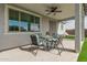 Inviting covered patio with outdoor seating and ceiling fan, great for relaxation at 11441 W La Reata Ave, Avondale, AZ 85392