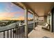 Covered balcony with seating offering neighborhood views and a colorful sunset at 1180 E Ibis St, Gilbert, AZ 85297