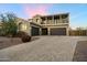 Beautiful home featuring a three-car garage and paver driveway at 1180 E Ibis St, Gilbert, AZ 85297